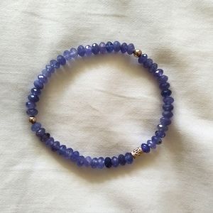 Tanzanite bracelet, 6.50", 925 silver accents, 4mm beads on stretch cord